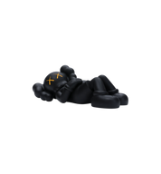 KAWS Holiday Japan Vinyl Figure Black side view at Stashed UAE