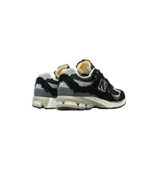 New Balance 2002R Protection Pack Black Grey heel view at Stashed UAE